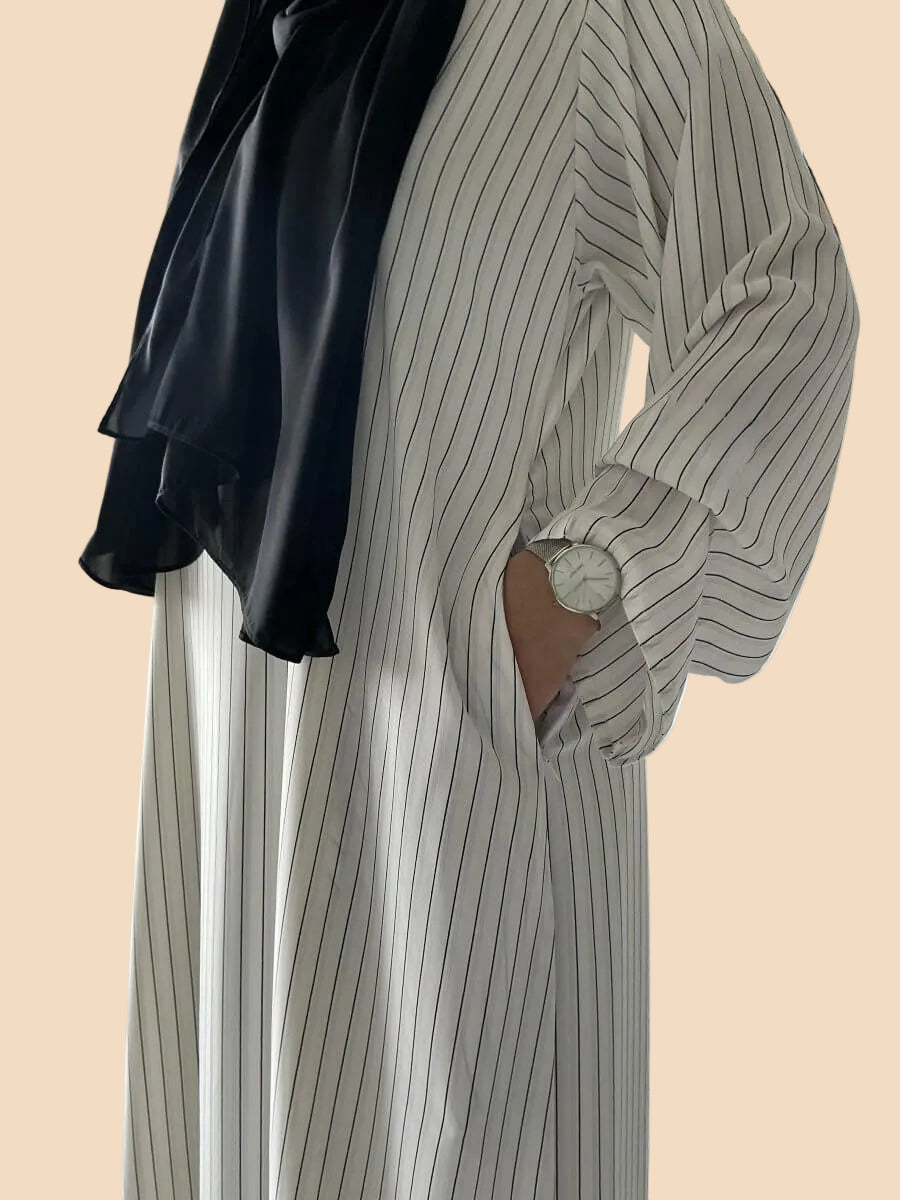 Pinstripe kaftan featuring black stripes and a stylish black scarf, perfect for elegant and comfortable dressing.